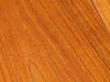 a close up of a wooden floor with a cat on it