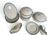 a group of plates and bowls that are sitting on a table