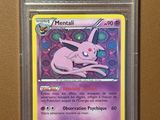 une carte Pokémon sur laquelle figure un Pokémon rose