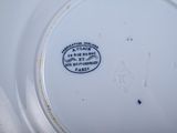 a white plate with a black and white label on it