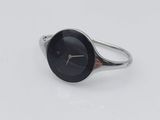an image of a silver ring with a black face on a white surface