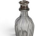 an image of a clear glass bottle with a silver lid