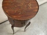 a small table with a floral design on it