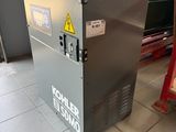 a machine that is sitting on the floor in a room
