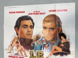a poster of a movie with a man and a woman on it
