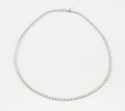 a white gold tennis necklace with diamonds on a white background