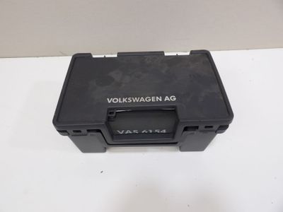 a close up of a black plastic box on a white surface
