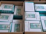 several boxes of electronic devices are stacked on top of each other