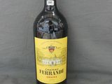 a bottle of wine that is sitting on a table
