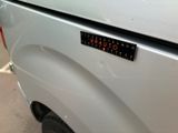 a sticker on the back of a pickup truck