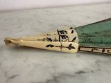 two wooden spoons sitting on top of a marble counter