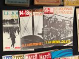 a lot of magazines on a table with a black background