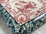 a box with a floral design on it on a table