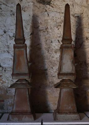 three different types of iron statues sitting on a table