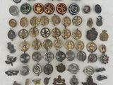 lot of vintage and antique military badges and badges