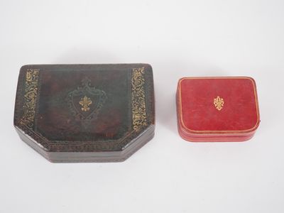 two small boxes sitting next to each other on a white surface