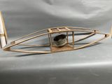 a small wooden boat that is sitting on a table