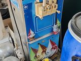 a blue and white ice cream machine next to a blue and white ice cream machine