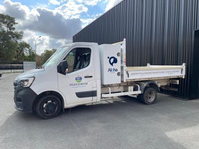 a white truck that is parked in front of a building