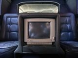 a small television sitting in the back of a car