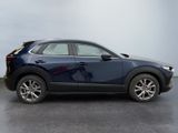 the mazda cx - hr suv is parked in a parking lot
