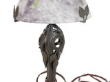 a lamp that has a glass shade on it