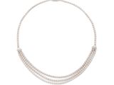 a white necklace with three rows of beads on a white background