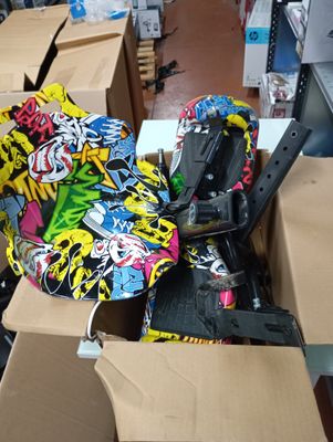 a pile of assorted skateboards and skateboards on the floor