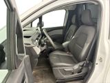 the interior of a car with the door open and the driver ' s seat down