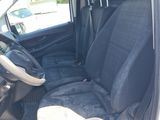 the interior of a car with a black seat cover and a steering wheel
