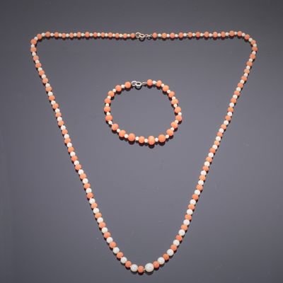 an orange and white beaded necklace and bracelet set