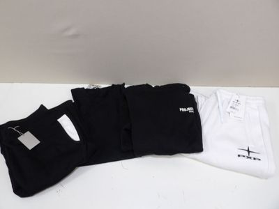 three pairs of black and white socks are on a white table
