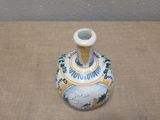 a small vase that is sitting on a table
