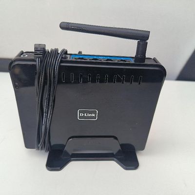 une petite boîte noire surmontée d'un cordon