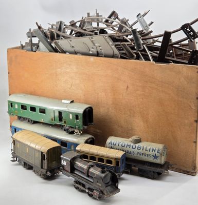a box full of old model trains and other toy trains