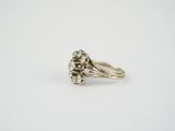 a close up of a diamond ring on a white background