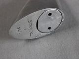 a close up of a metal object with a smiley face on it