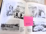 an open book with pictures of people and a pink post it on it