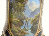 a vase with a painting of a bridge on it