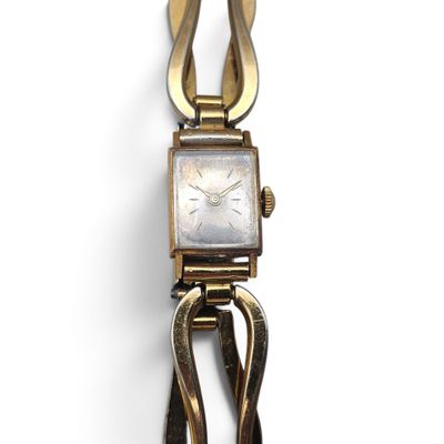 a close up of a wrist watch with a metal clasp