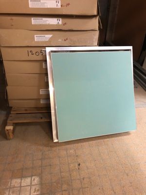 a picture of a picture frame sitting on the floor in front of a stack of boxes
