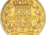 a close up of a gold coin with a crown on it