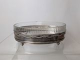 a glass bowl that is sitting on top of a table