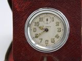 a clock that is sitting in a box on a table
