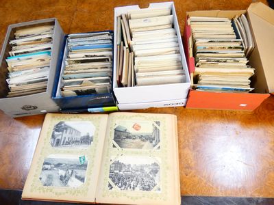 several boxes of old books are sitting on a wooden table