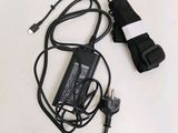an image of a charger and cord on a white surface