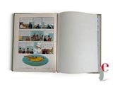 an open book with a picture of a plane in it