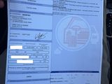 a person holding up a paper with a picture of a house on it