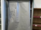 two refrigerators that have been wrapped up in a store