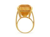 a close up of a gold ring with a stone in the middle